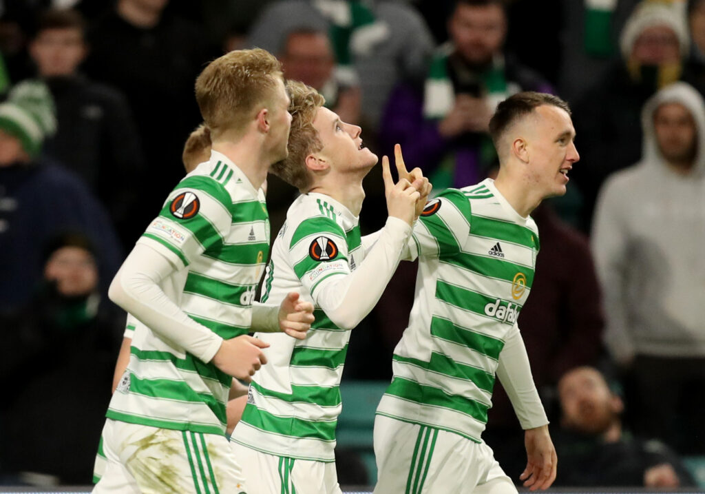 Celtic's Ewan Henderson celebrates scoring their second goal with teammates
