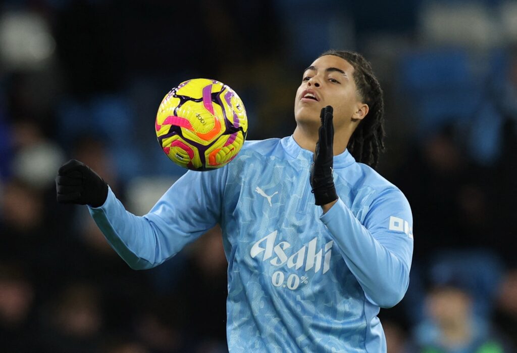 Jahmai Simpson-Pusey warming up for Man City