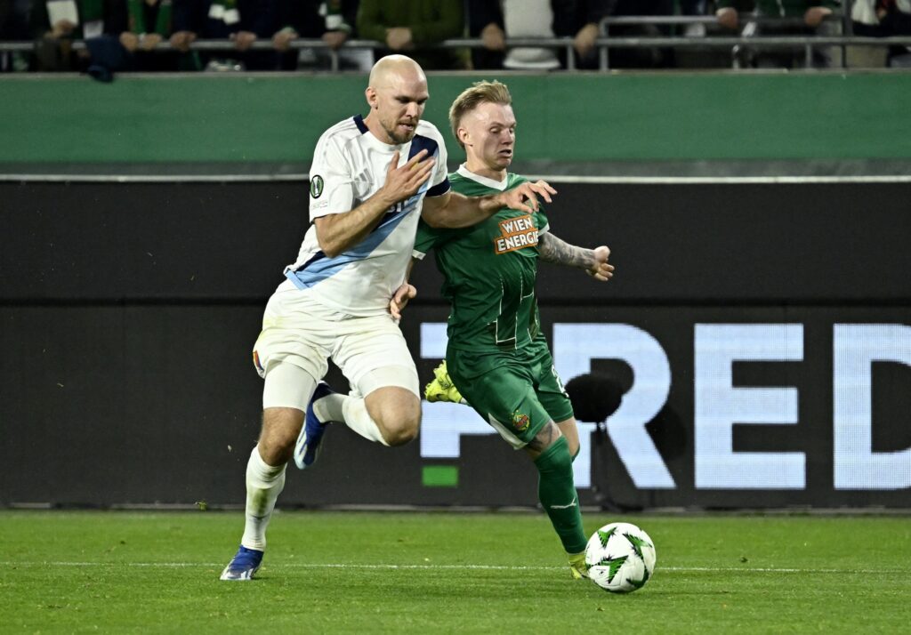 Djurgarden's Marcus Danielsson in action with Rapid Vienna's Isak Jansson
