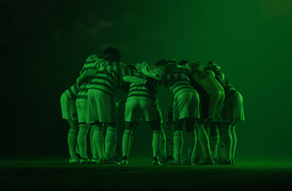 Huddle under green light